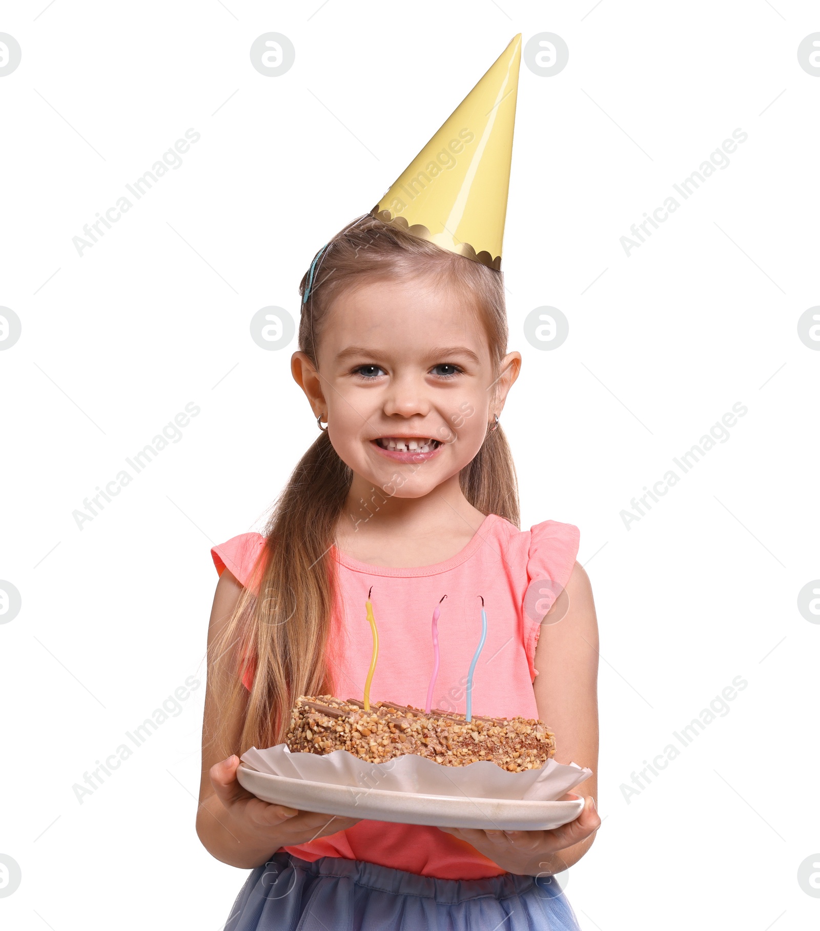 Photo of Birthday celebration. Cute little girl in party hat holding tasty cake on white background