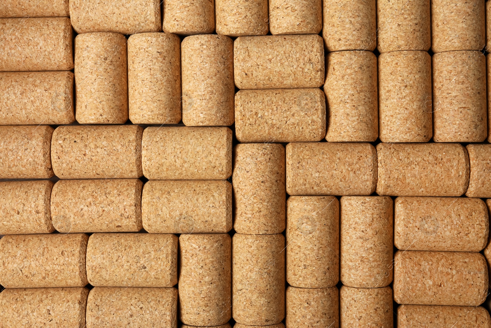 Photo of Many wine bottle corks as background, top view