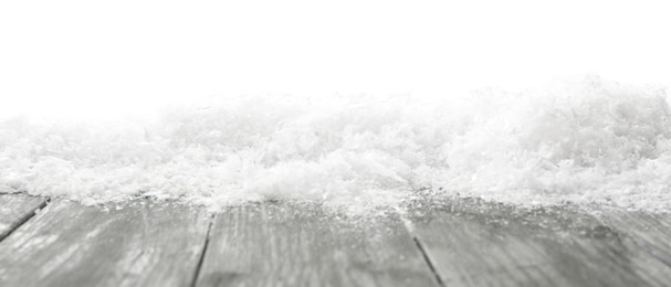 Snow on grey wooden surface against white background. Christmas season