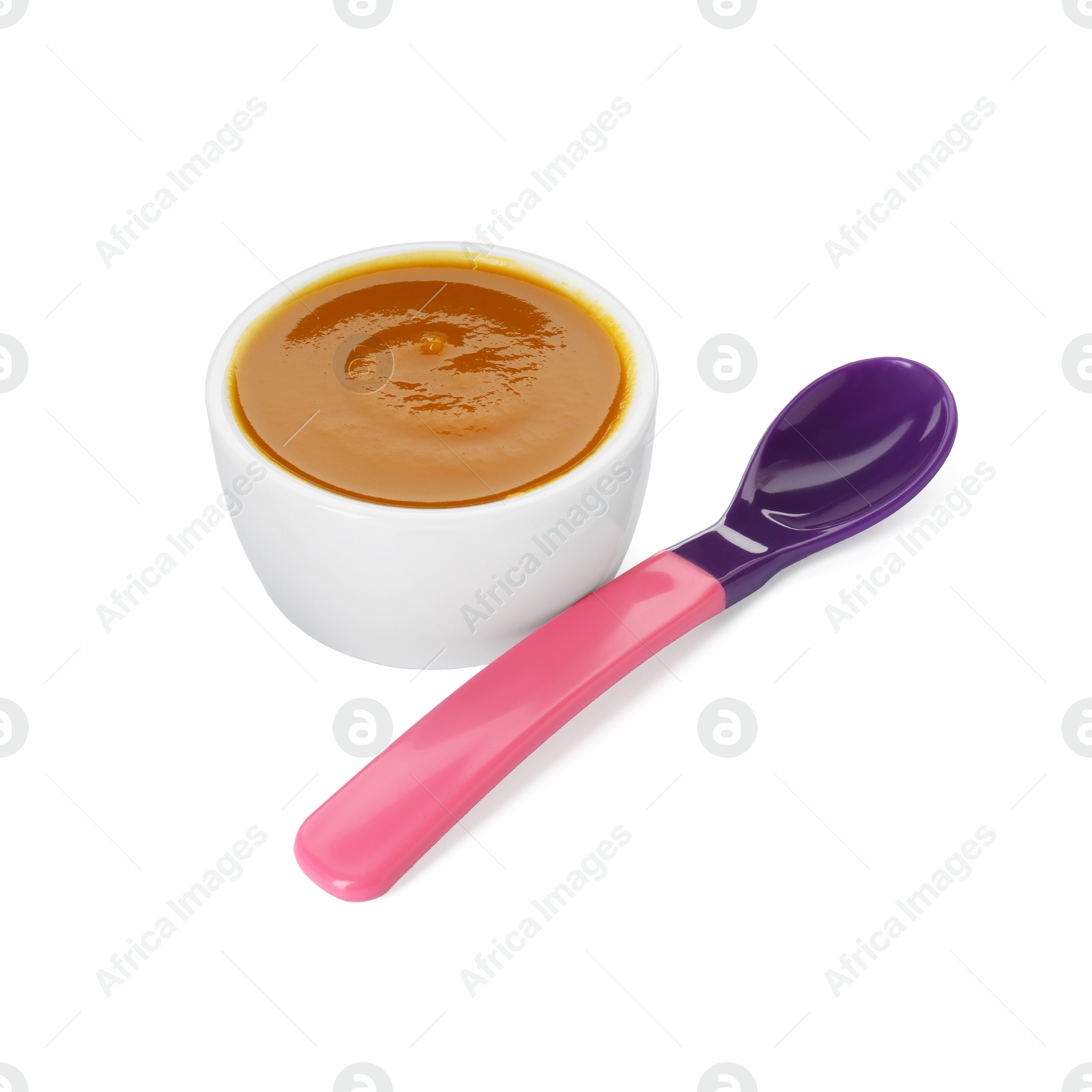 Photo of Bowl with healthy baby food and spoon isolated on white