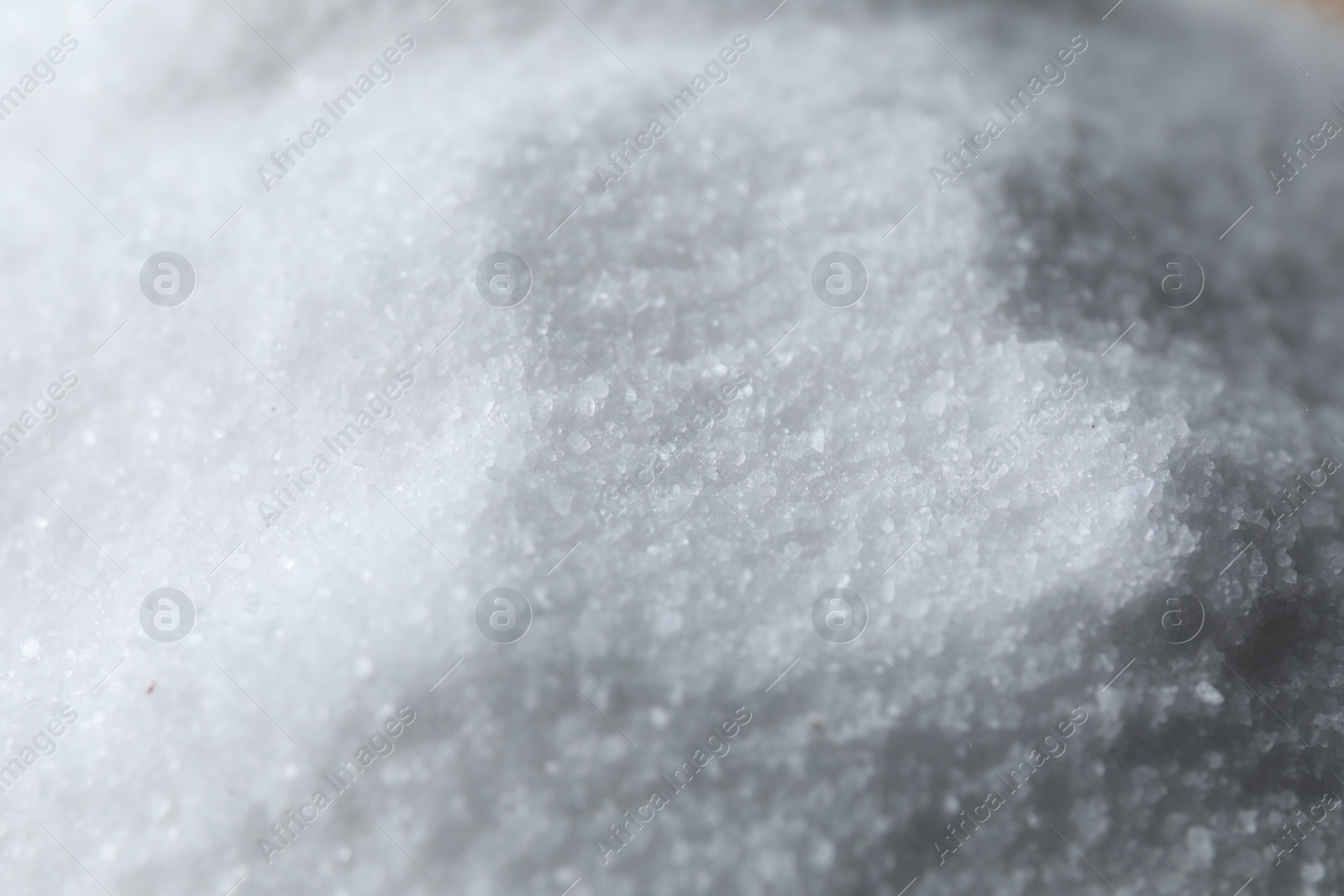 Photo of Organic white sea salt as background, closeup