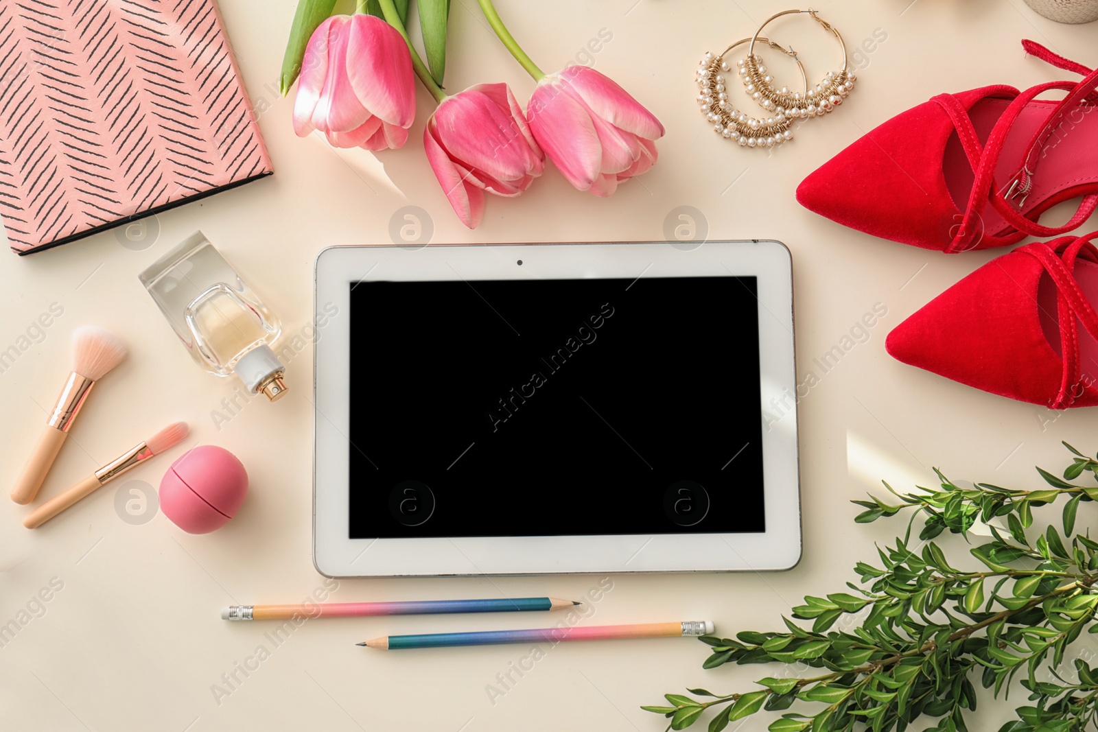 Photo of Flat lay composition with tablet and accessories on light background, space for design. Blogger's workplace