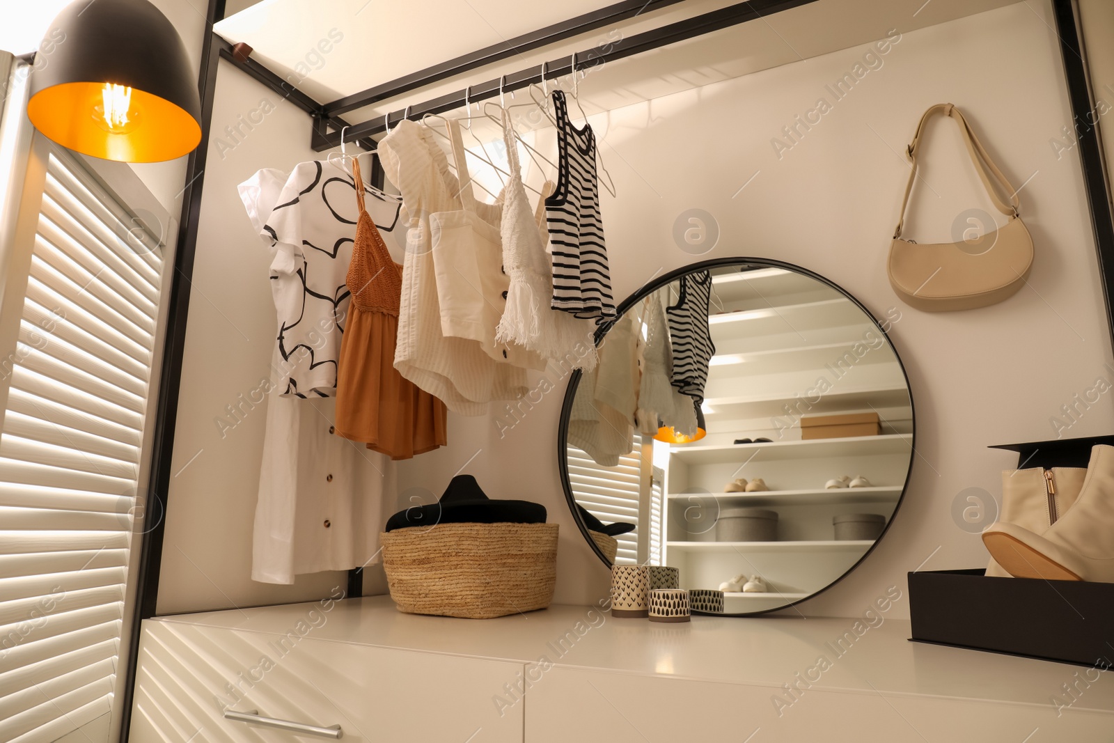 Photo of Closet interior with storage rack for clothes and accessories