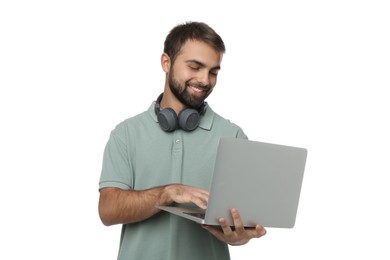 Photo of Student with headphones using laptop on white background