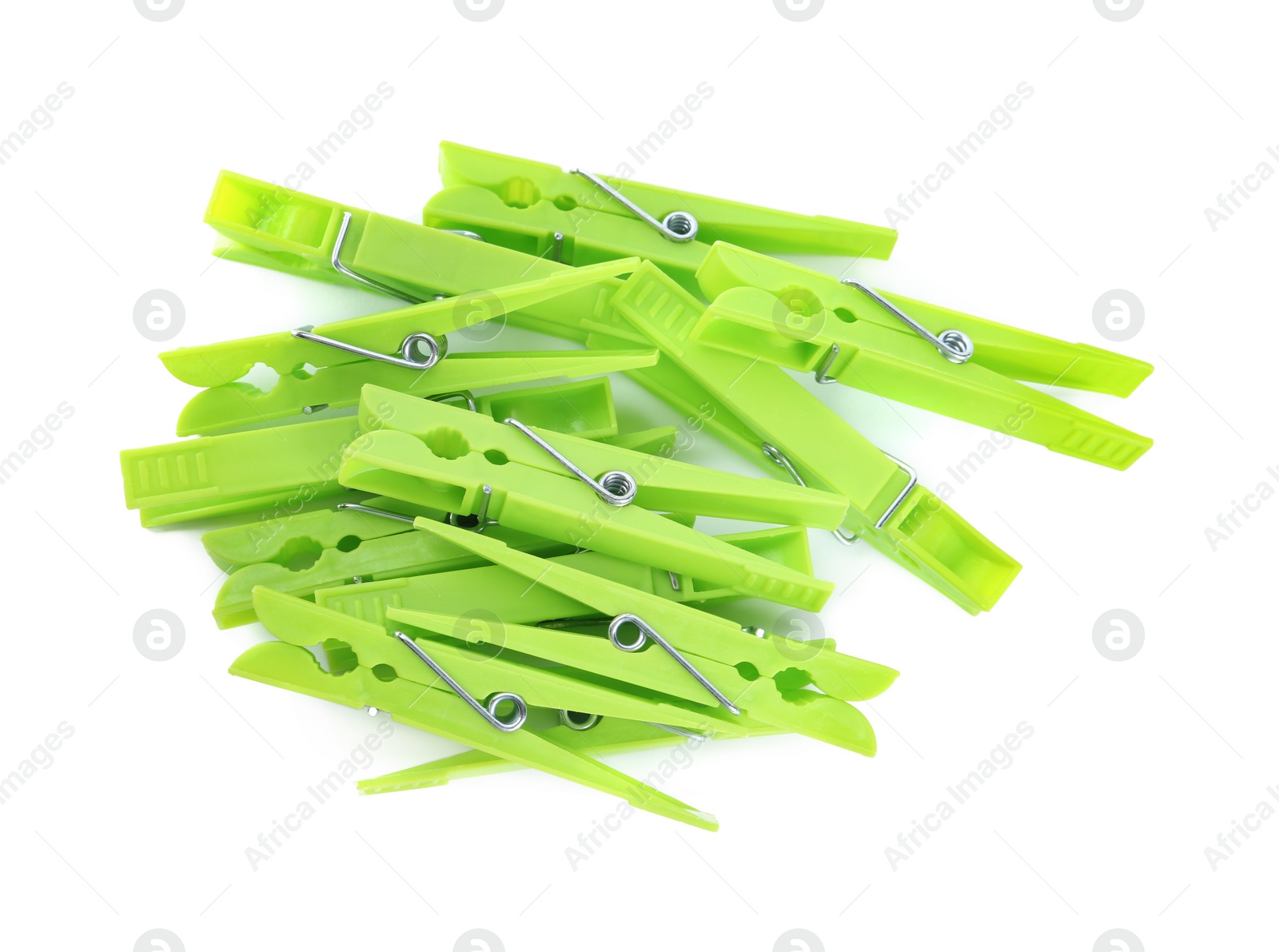 Photo of Bright green plastic clothespins on white background, top view