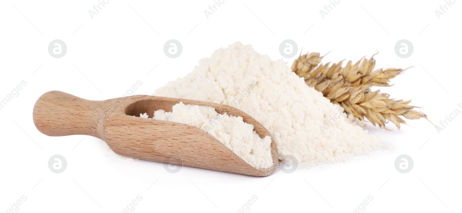 Photo of Scoop with wheat flour and spikes isolated on white