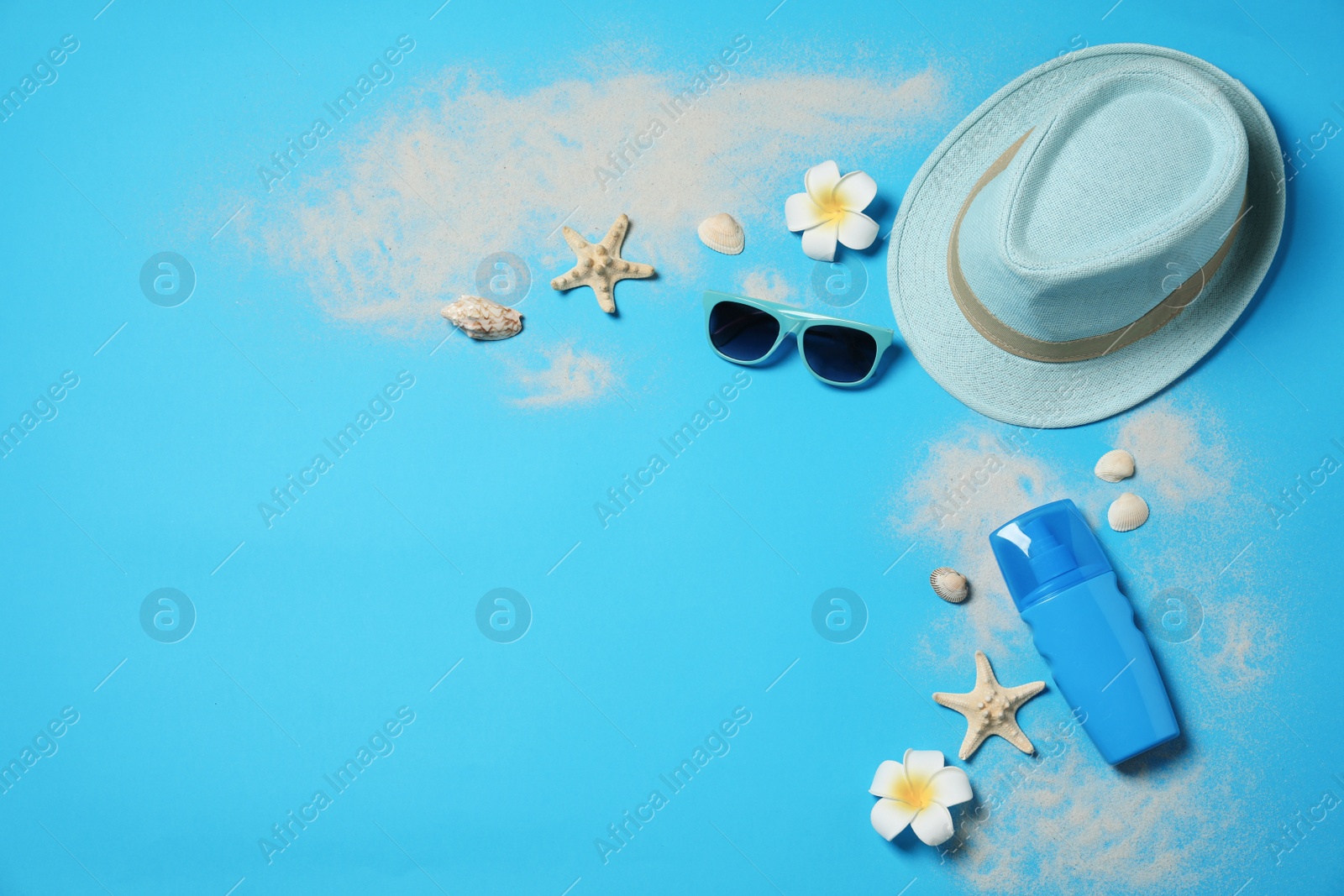 Photo of Flat lay composition with beach accessories on color background, space for text