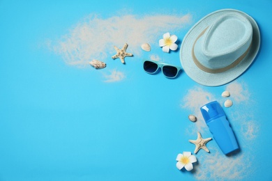 Flat lay composition with beach accessories on color background, space for text