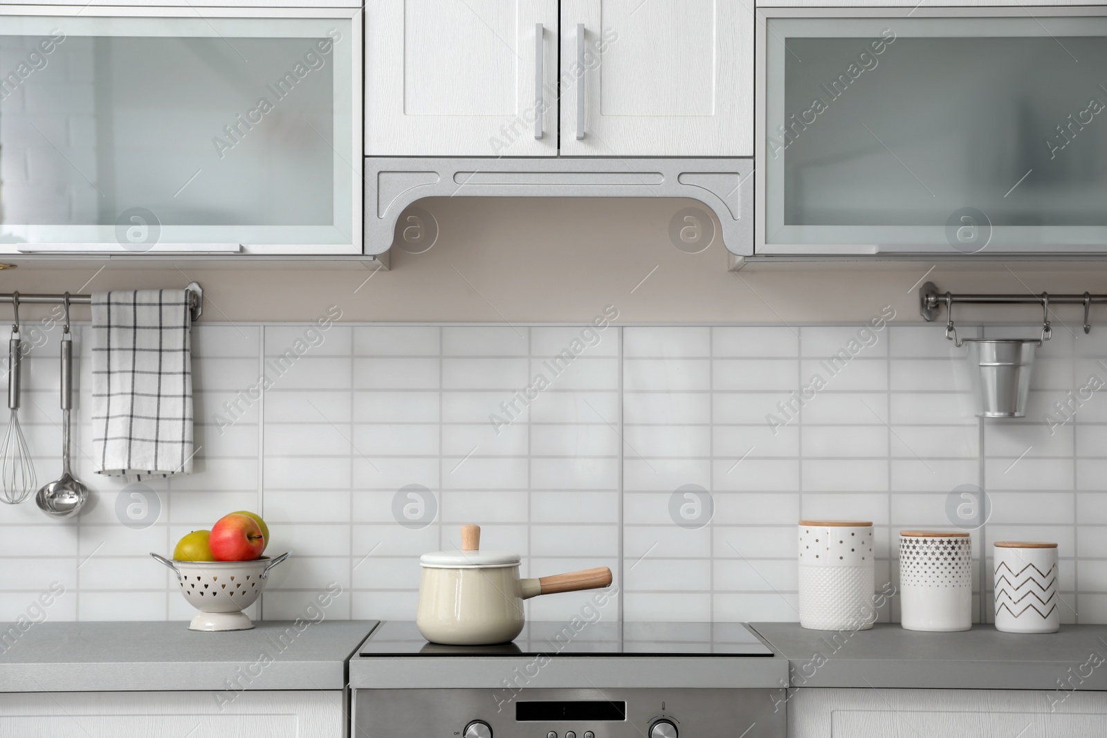 Photo of Modern kitchen interior with houseware and new furniture