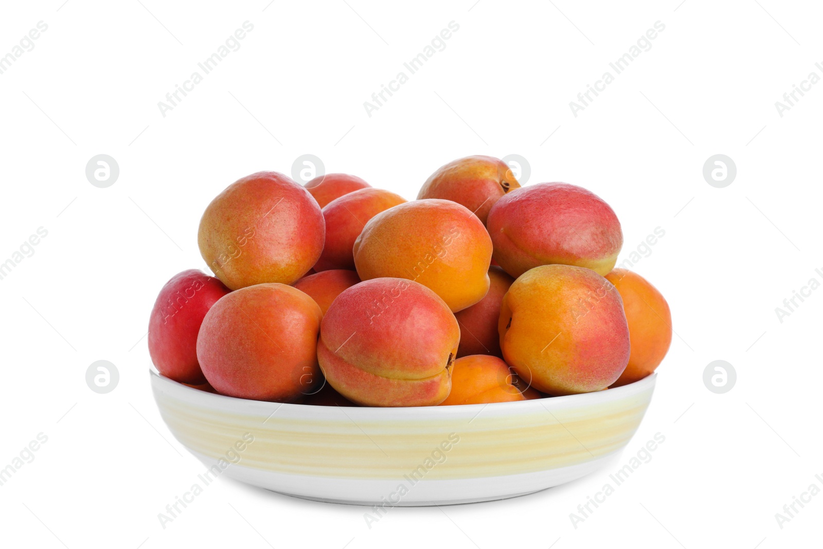 Photo of Delicious ripe apricots in plate isolated on white