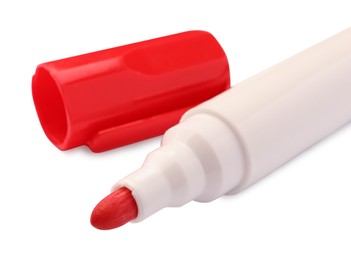 Photo of Bright red marker isolated on white, closeup. School stationery