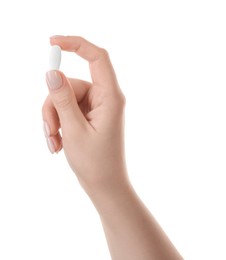 Photo of Woman holding vitamin pill on white background, closeup. Health supplement