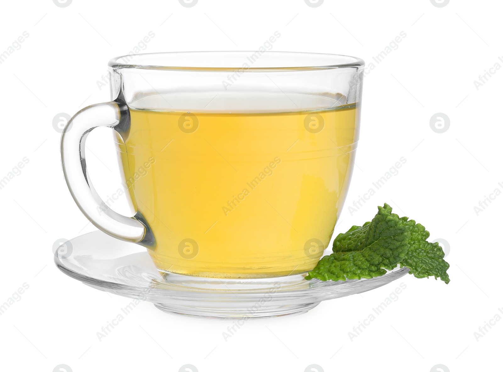 Photo of Fresh green tea in glass cup, mint and saucer isolated on white