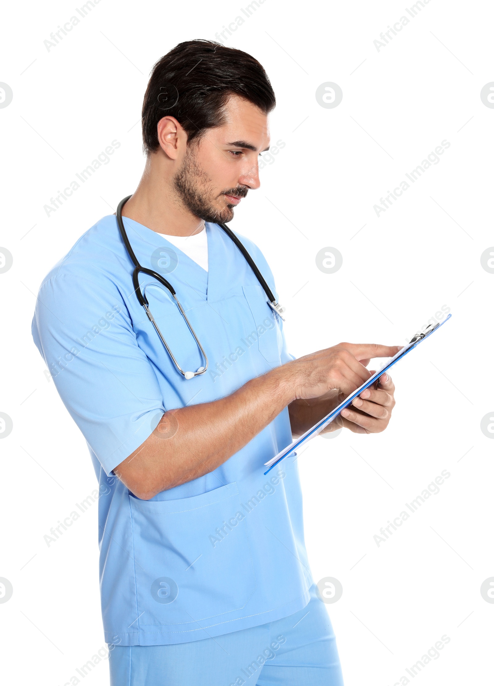 Photo of Young male doctor in uniform with stethoscope and clipboard on white background. Medical service