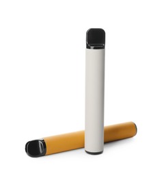 Photo of Two disposable electronic smoking devices on white background