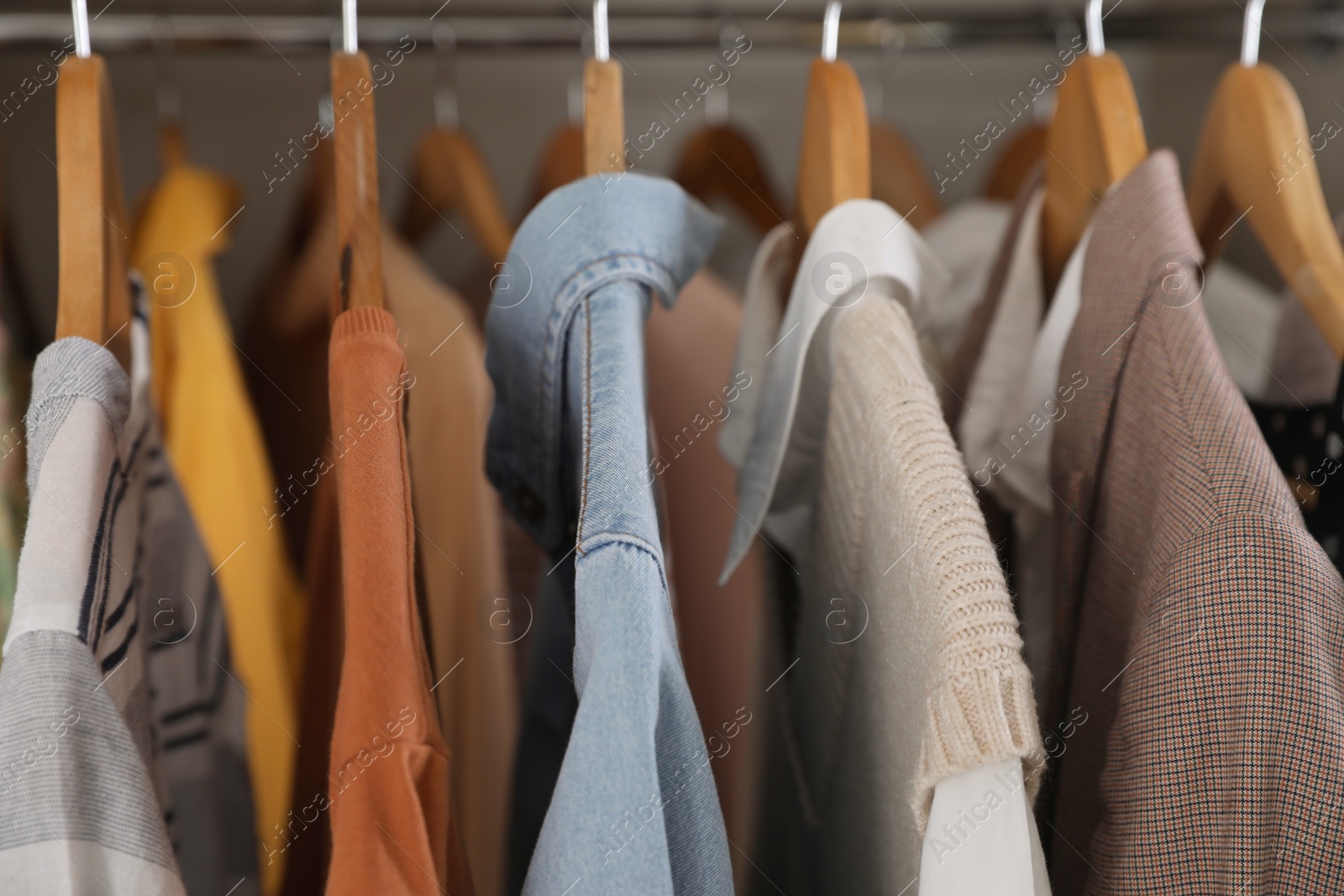 Photo of Wardrobe closet with different stylish clothes, closeup