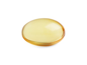 Photo of One yellow pill on white background. Medicinal treatment