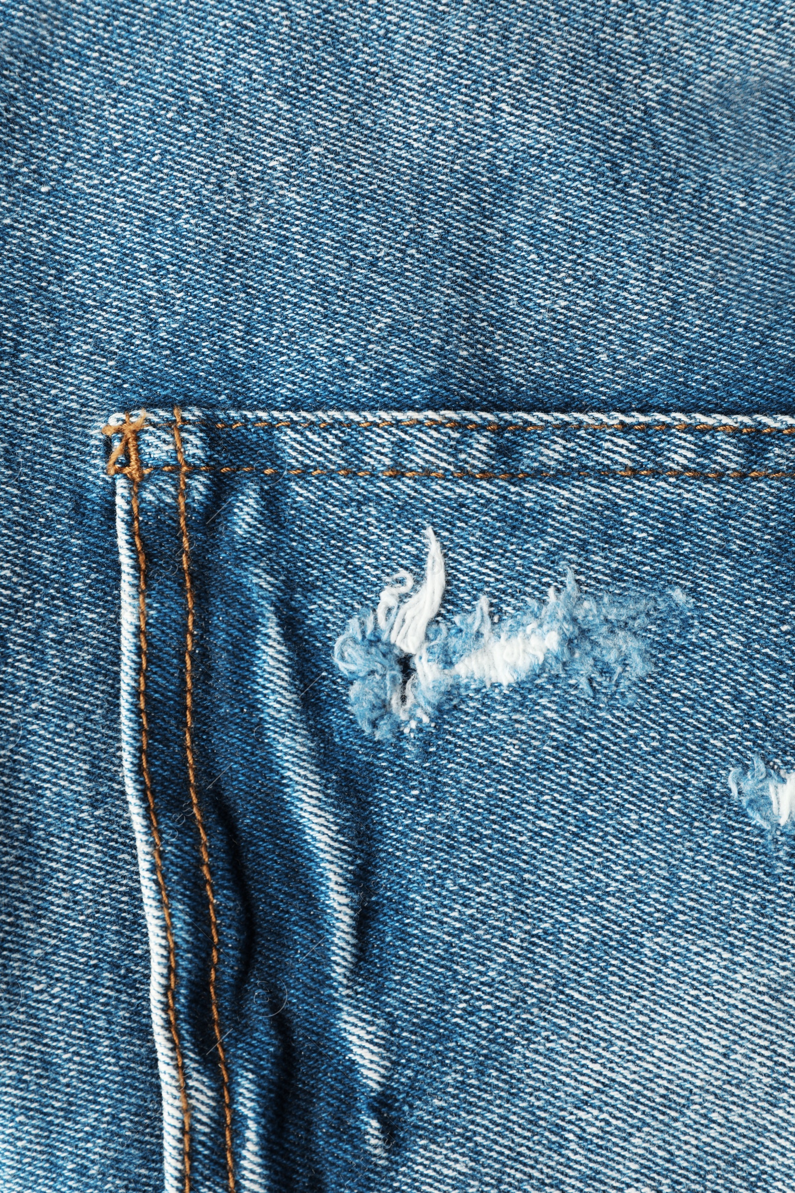 Photo of Closeup view of jeans pocket as background