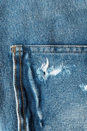 Photo of Closeup view of jeans pocket as background