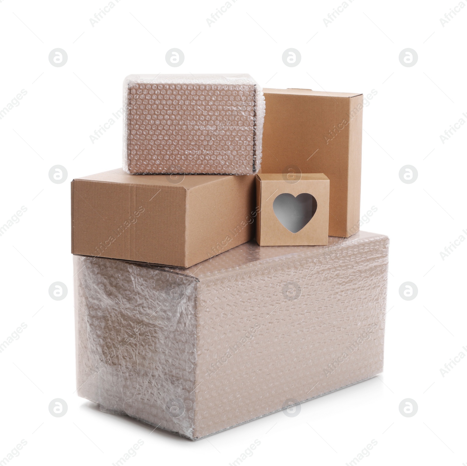 Photo of Cardboard boxes packed in bubble wrap and ordinary ones on white background