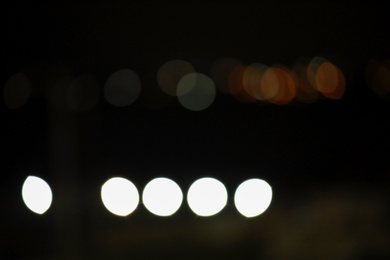 Photo of Blurred view of night city. Bokeh effect