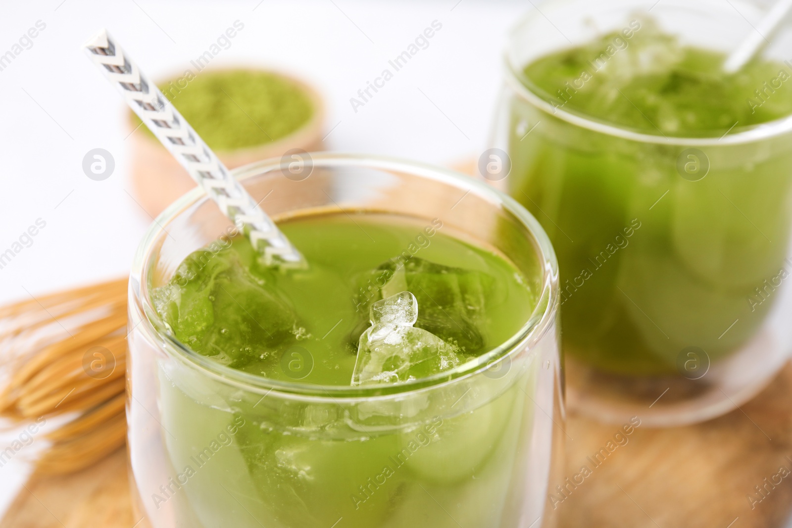 Photo of Glass of delicious iced green matcha tea, closeup