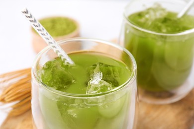 Glass of delicious iced green matcha tea, closeup