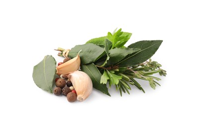 Photo of Bundle of aromatic bay leaves, different herbs and spices isolated on white