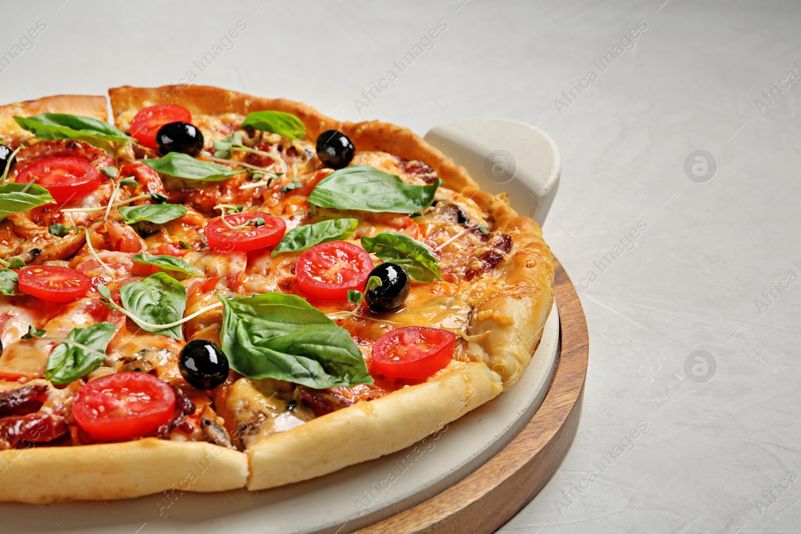 Photo of Tasty fresh homemade pizza on table, closeup