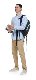 Young man with backpack and books on white background