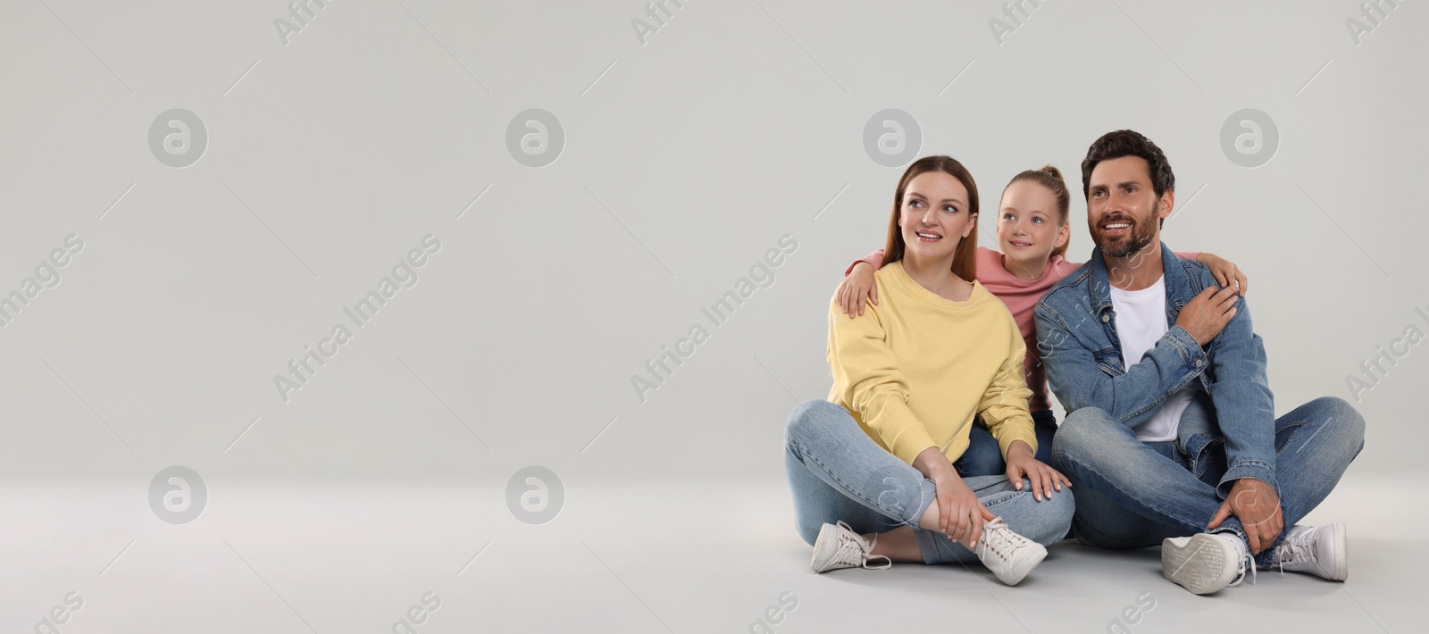 Image of Happy family with child on light grey background, space for text. Banner design