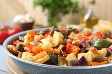Photo of Delicious ratatouille in frying pan, closeup view