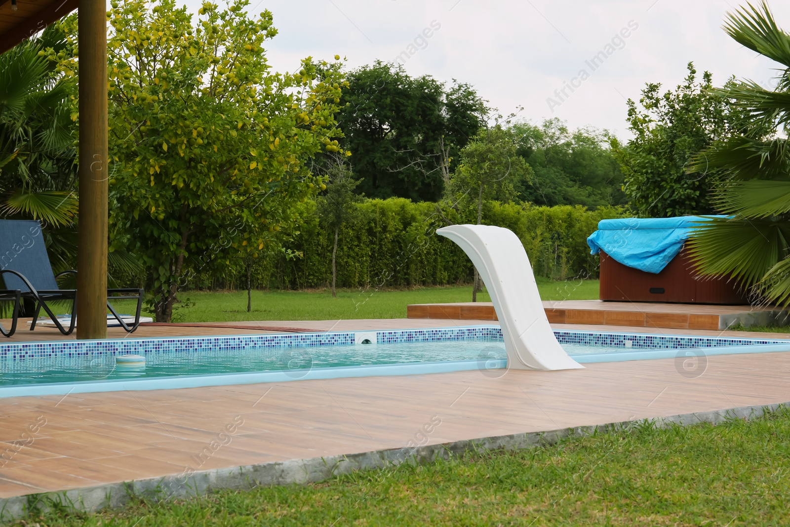 Photo of Outdoor swimming pool with clear water at resort