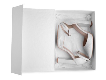 Photo of Pair of stylish leather shoes in box on white background, top view