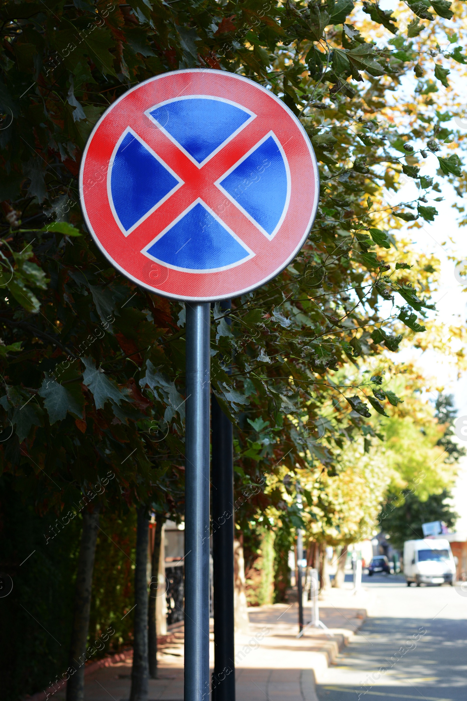 Photo of Road sign No Stopping outdoors on sunny day