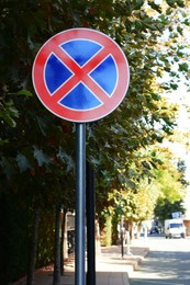 Road sign No Stopping outdoors on sunny day