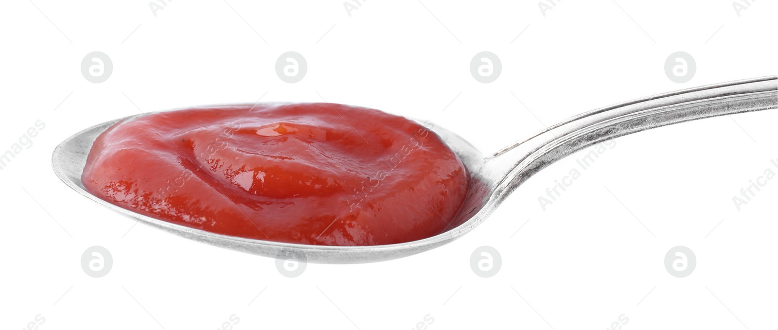 Photo of Tasty tomato sauce in spoon isolated on white