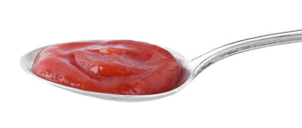 Tasty tomato sauce in spoon isolated on white