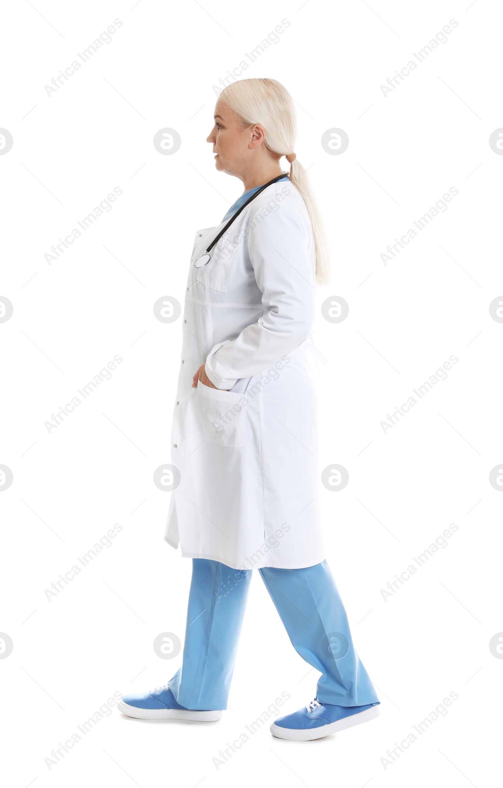 Photo of Full length portrait of female doctor isolated on white. Medical staff