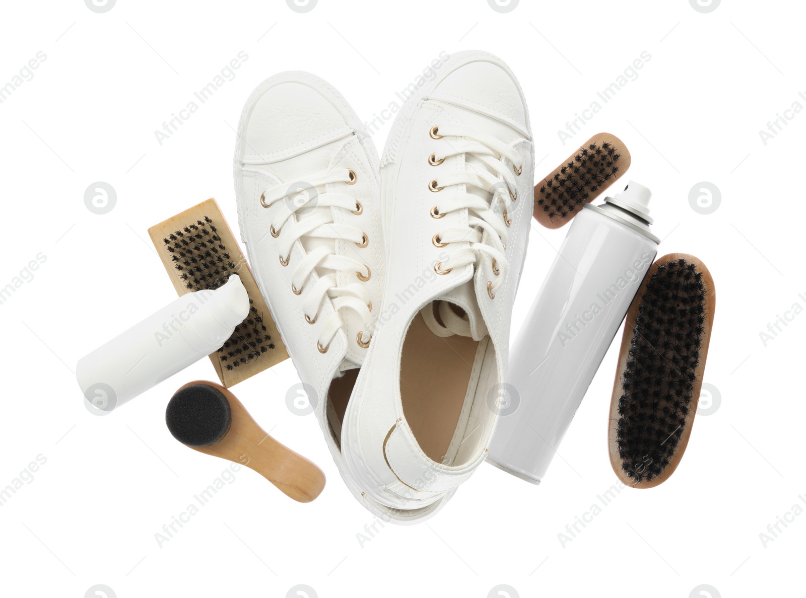 Photo of Composition with stylish footwear and shoe care accessories on white background, top view