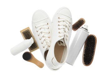 Composition with stylish footwear and shoe care accessories on white background, top view