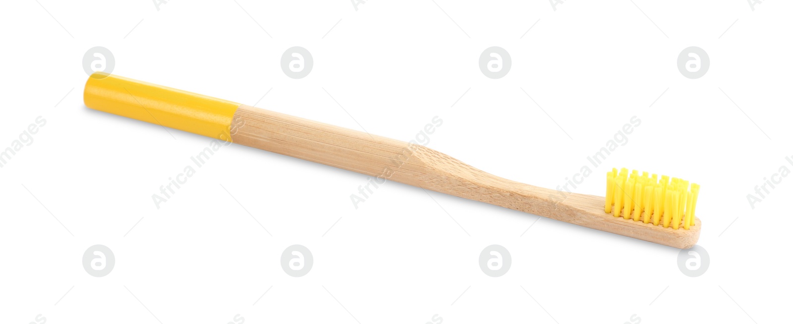 Photo of Bamboo toothbrush with yellow bristle isolated on white