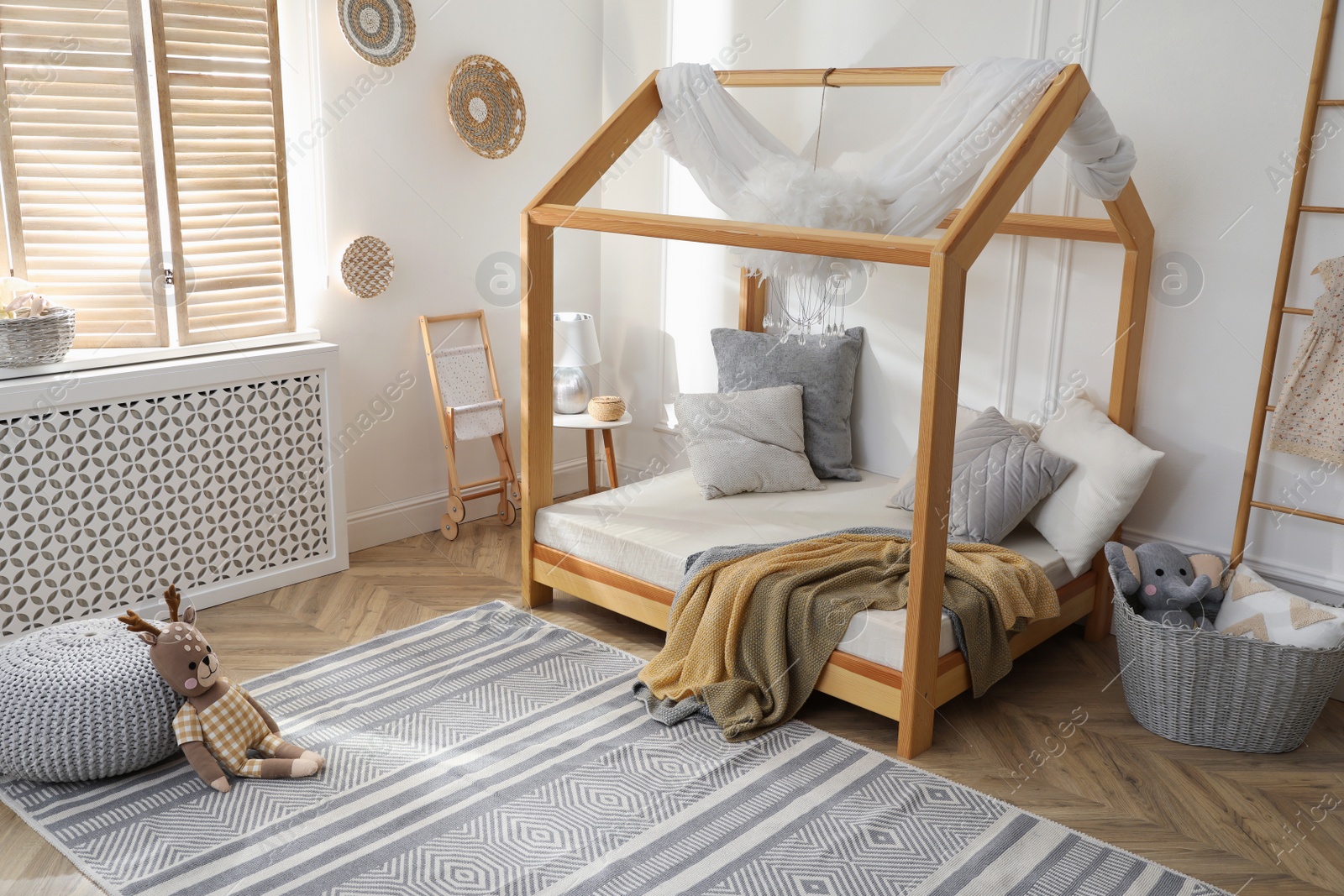 Photo of Stylish child room interior with house bed