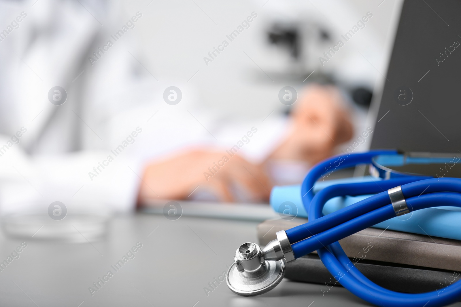 Photo of Medical students stuff on table against blurred background. Space for text