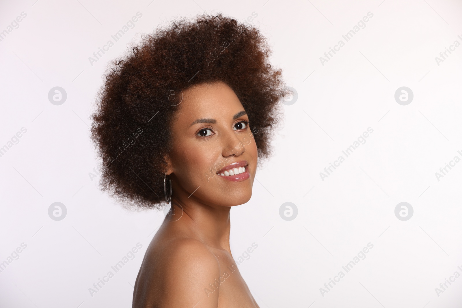 Photo of Portrait of beautiful young woman with glamorous makeup on white background. Space for text