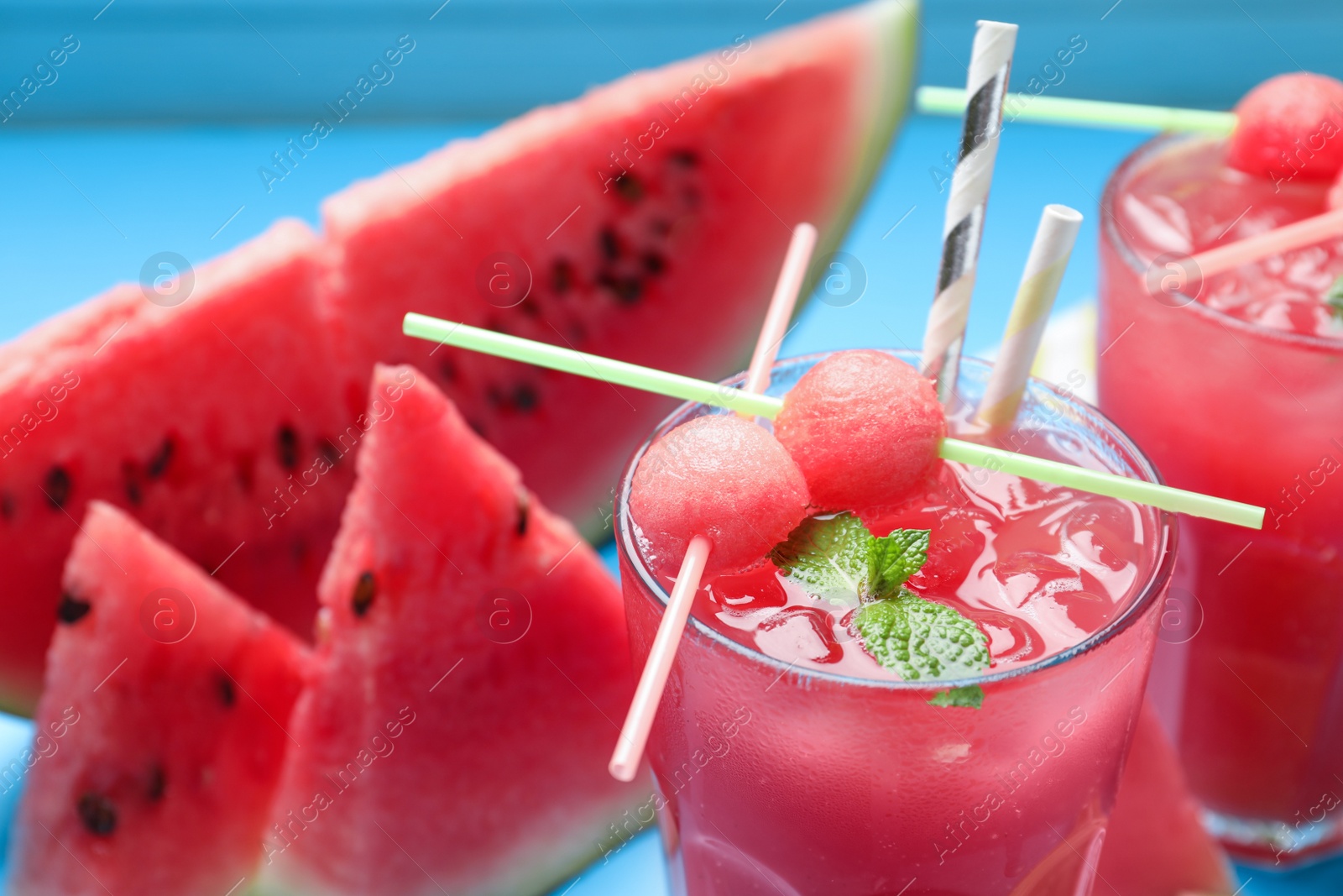 Photo of Tasty watermelon drink with fresh fruit and mint, closeup