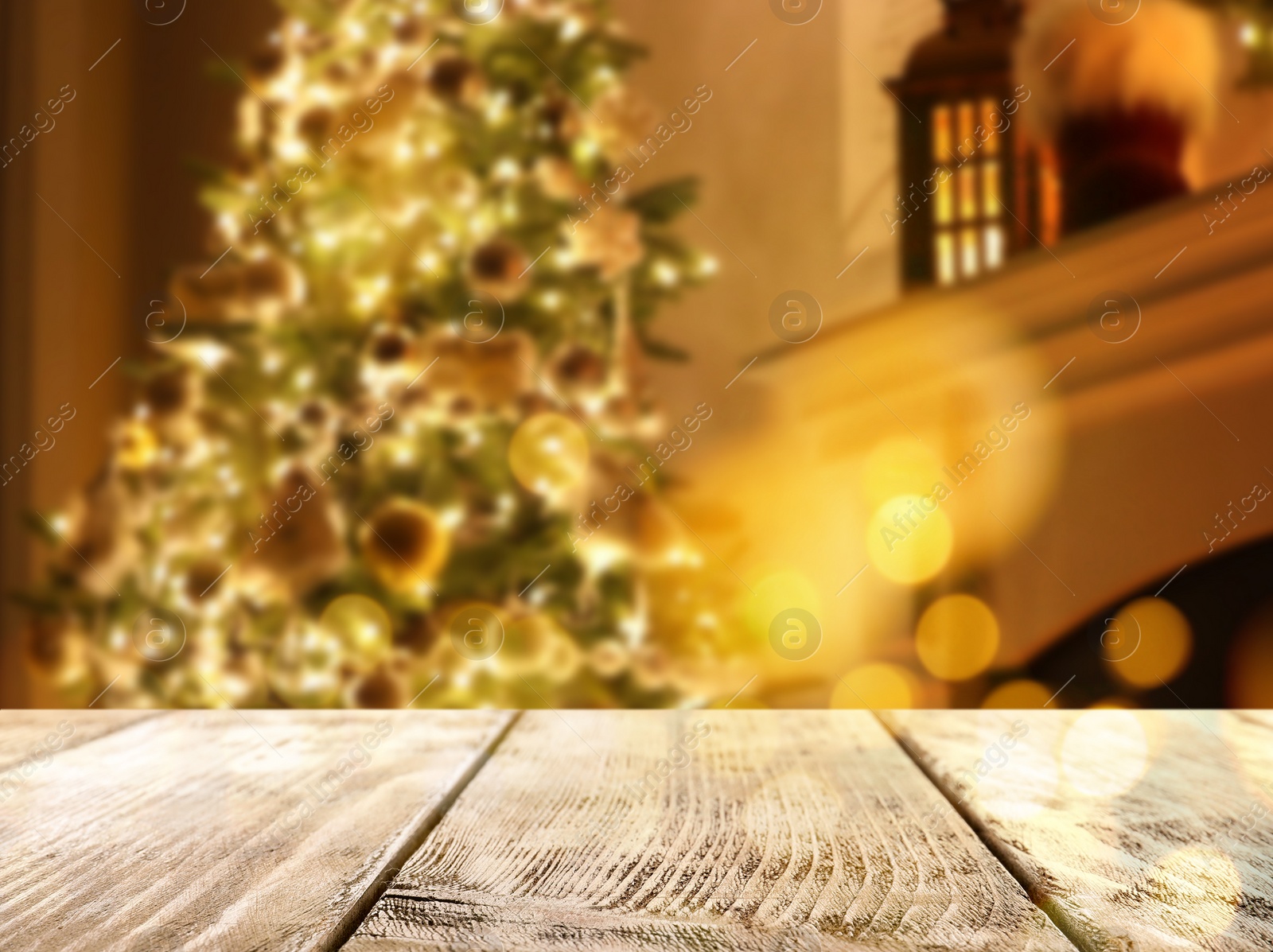 Image of Empty wooden surface and blurred view of Christmas tree in room, space for text. Interior design