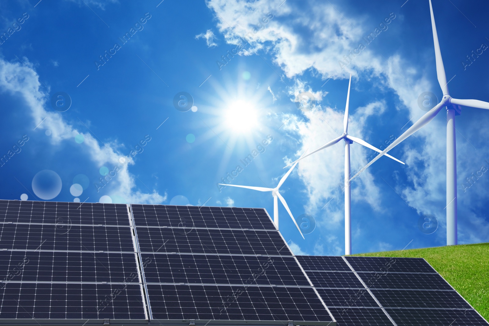 Image of Solar panels and wind turbines installed outdoors. Alternative energy source