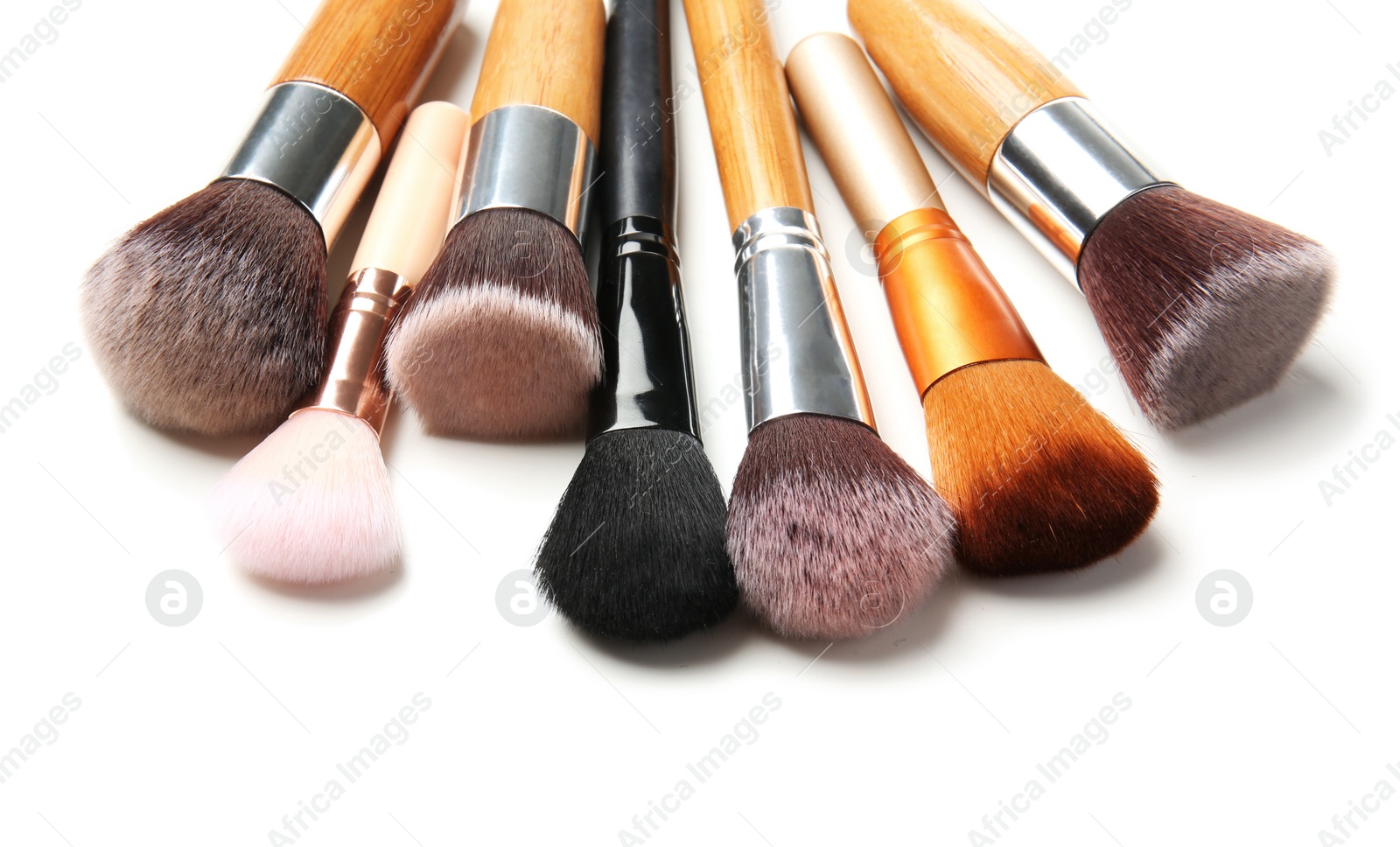 Photo of Makeup brushes of professional artist on white background