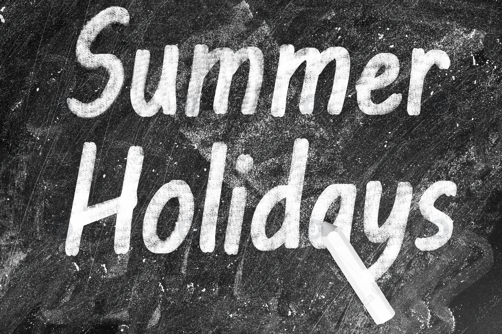 Image of Inscription Summer Holidays on blackboard, top view. School's Out.